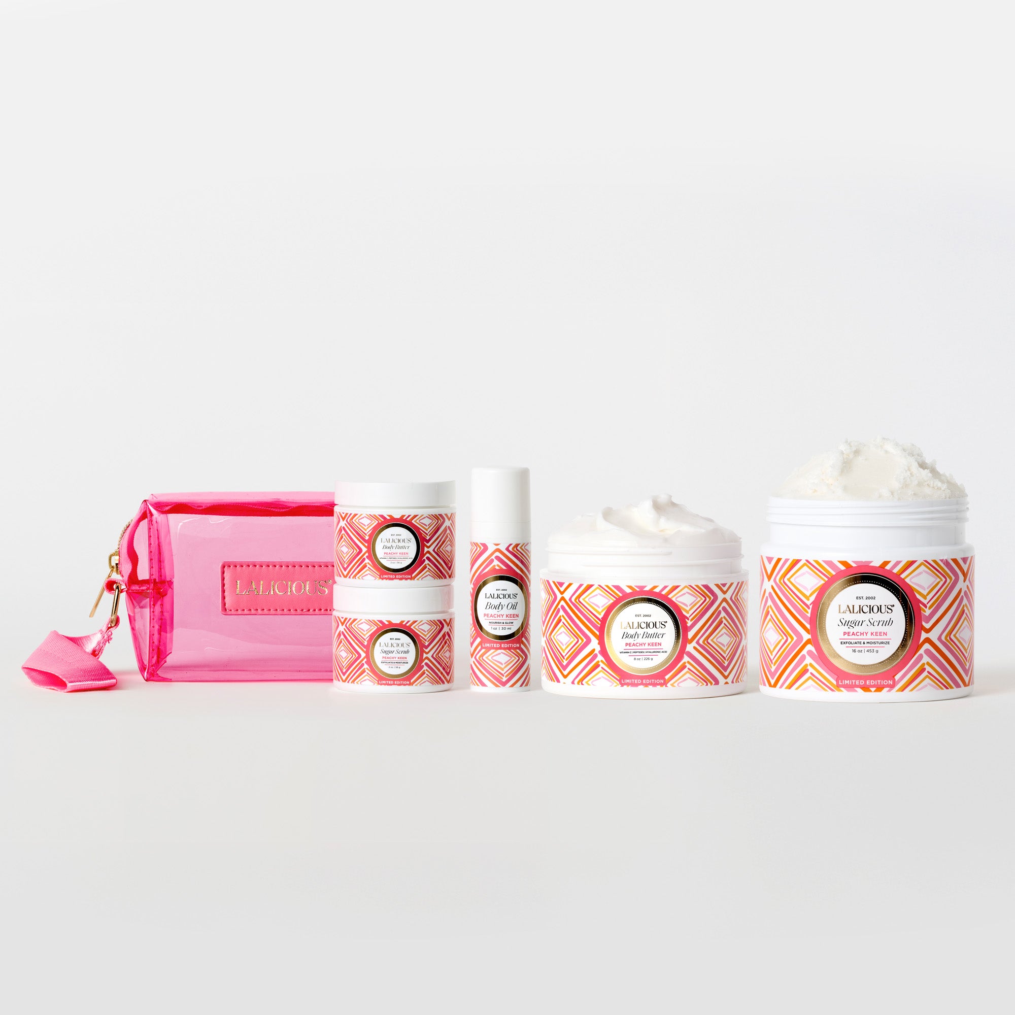 Peachy Keen Collection 8oz Body butter, 16oz Sugar Scrub, 2oz body butter, 2oz sugar scrub, 1oz body oil, peachy keen pink wristlet on a white background. - LALICIOUS