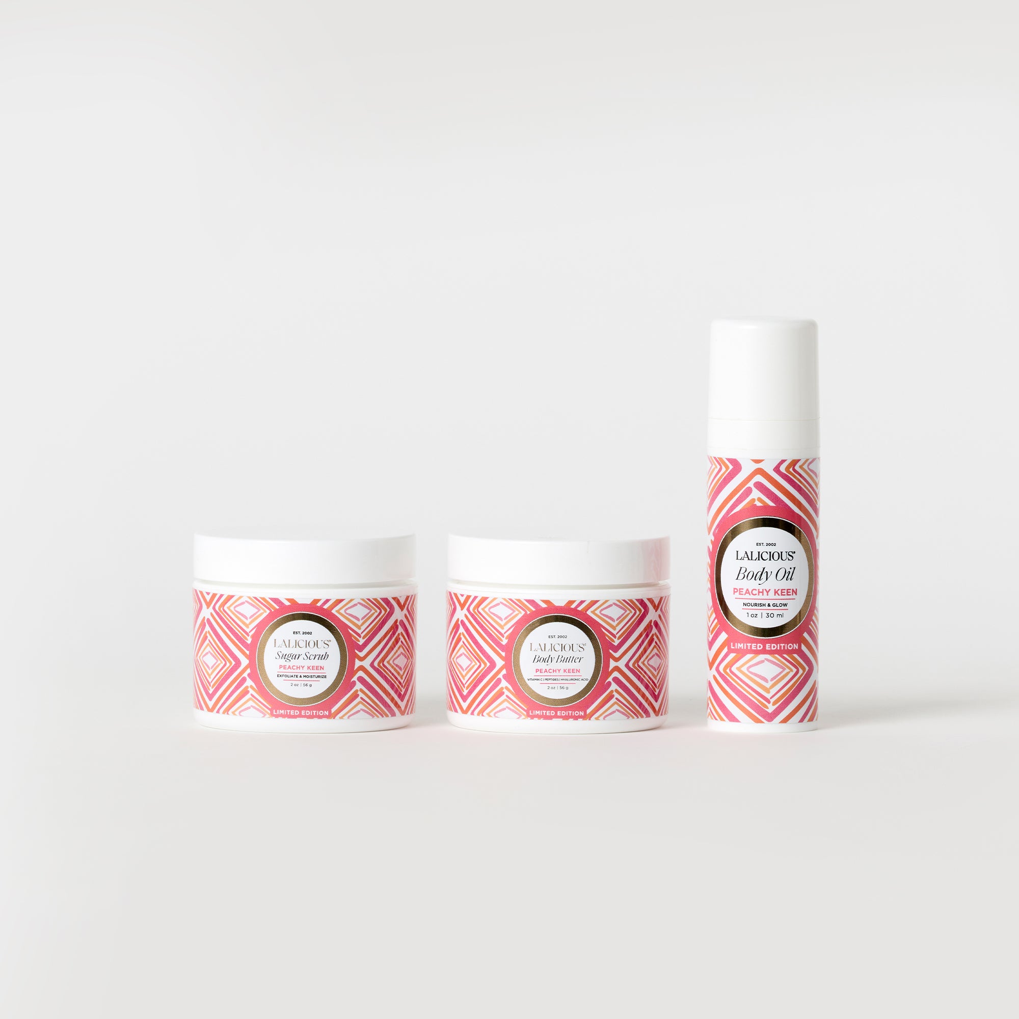 Peachy Keen Travel Set with three products 2oz Body Butter jar, 2oz Sugar Scrub jar and oz Body Oil on a white background- LALICIOUS