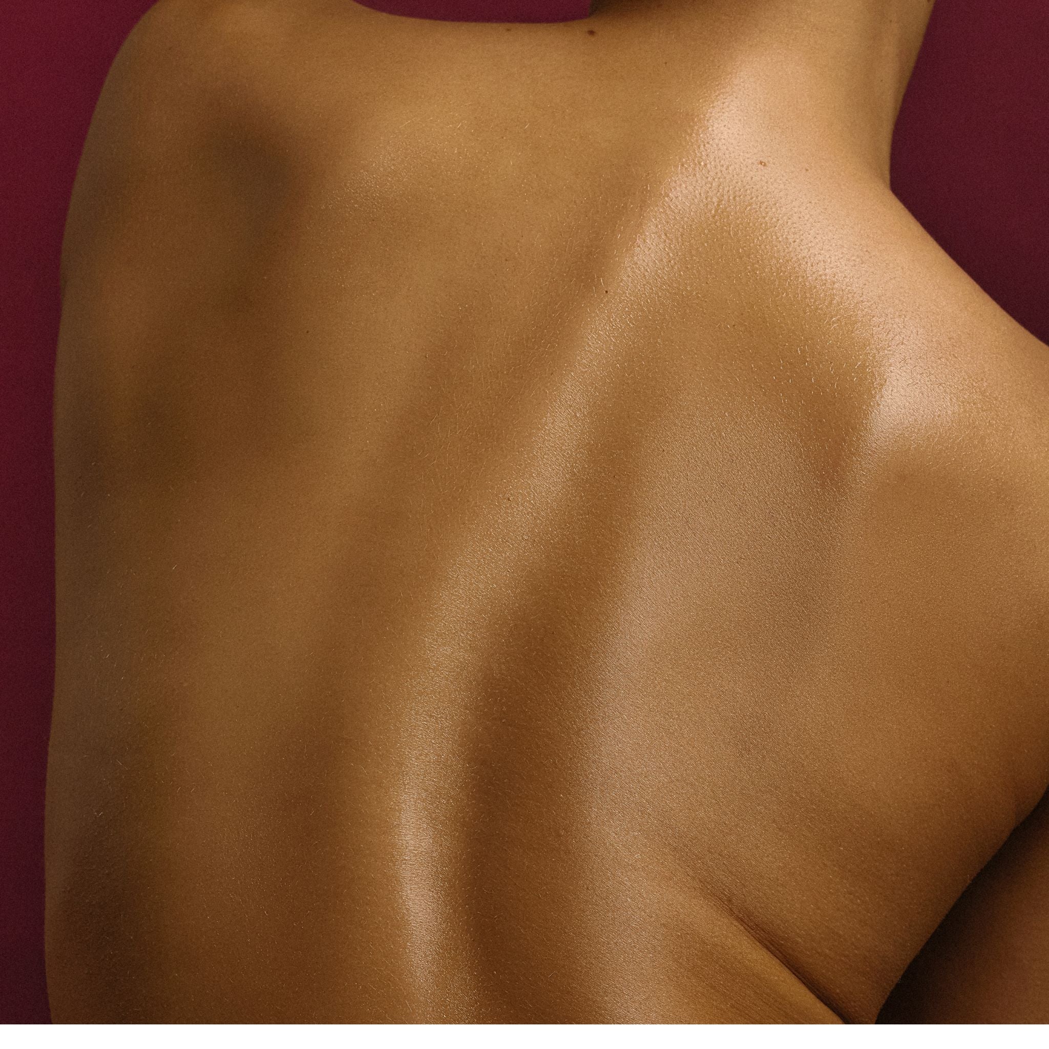 Back of a woman with Peachy Keen Body oil. LALICIOUS