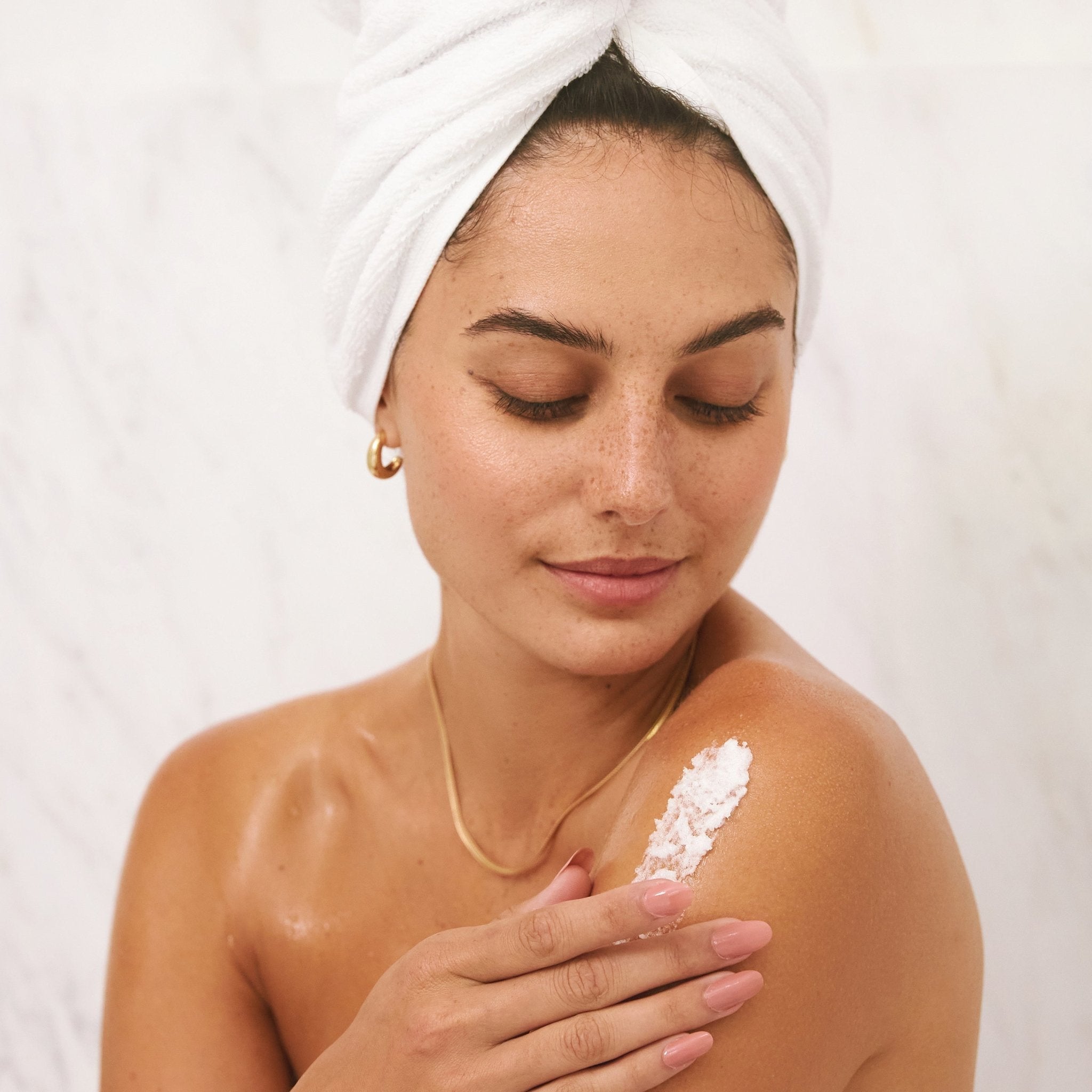 The Signature Collection Sugar Scrub on skin of model - LALICIOUS